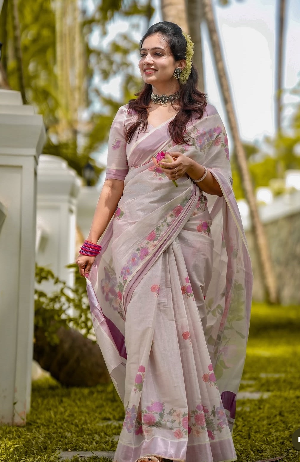 Traditional pink floral Kerala saree