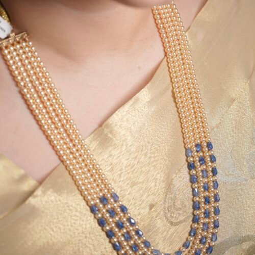 The layered multi-strand pearl and sapphire necklace